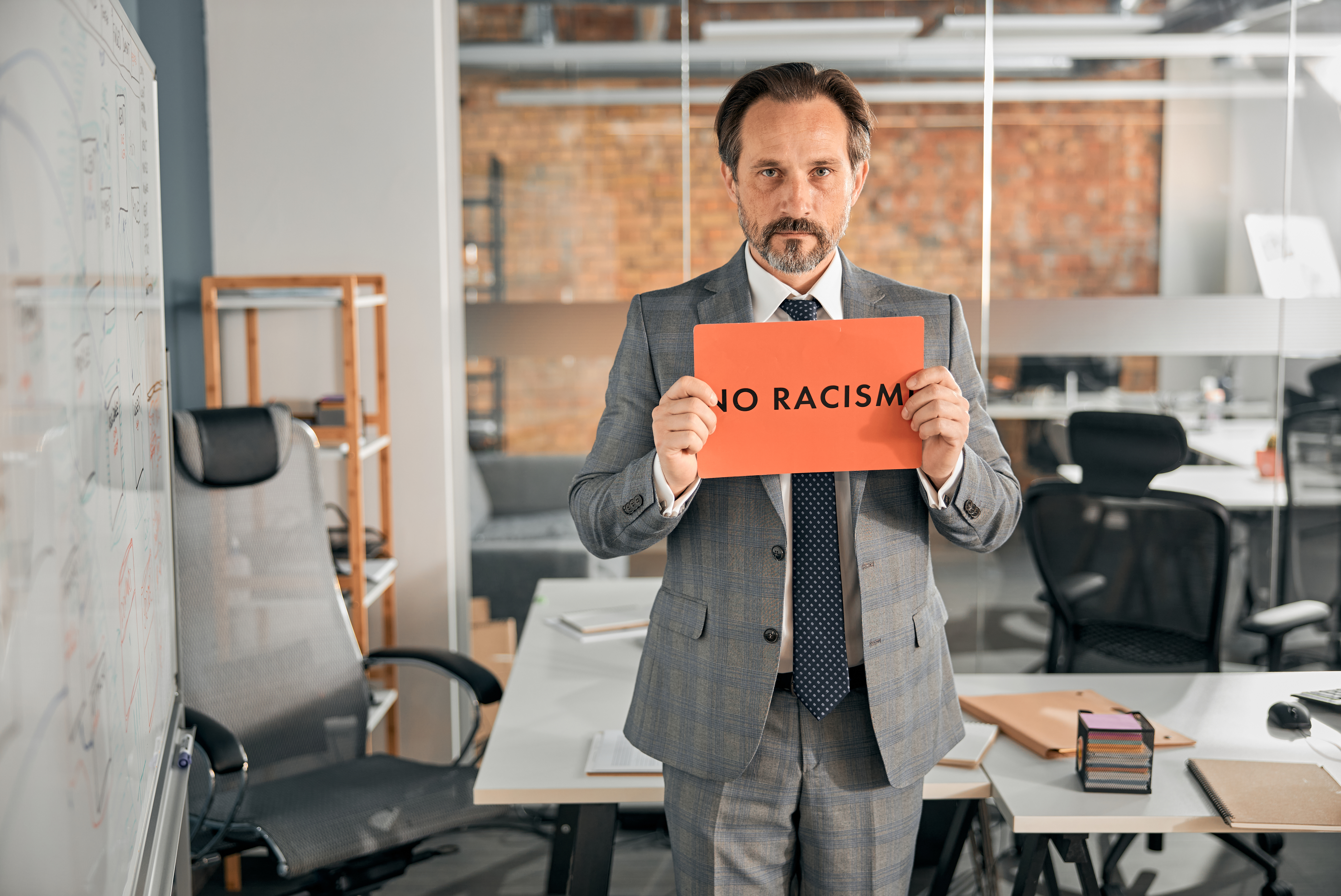 serious man standing in office and holding no raci 2022 02 03 00 57 47 utc